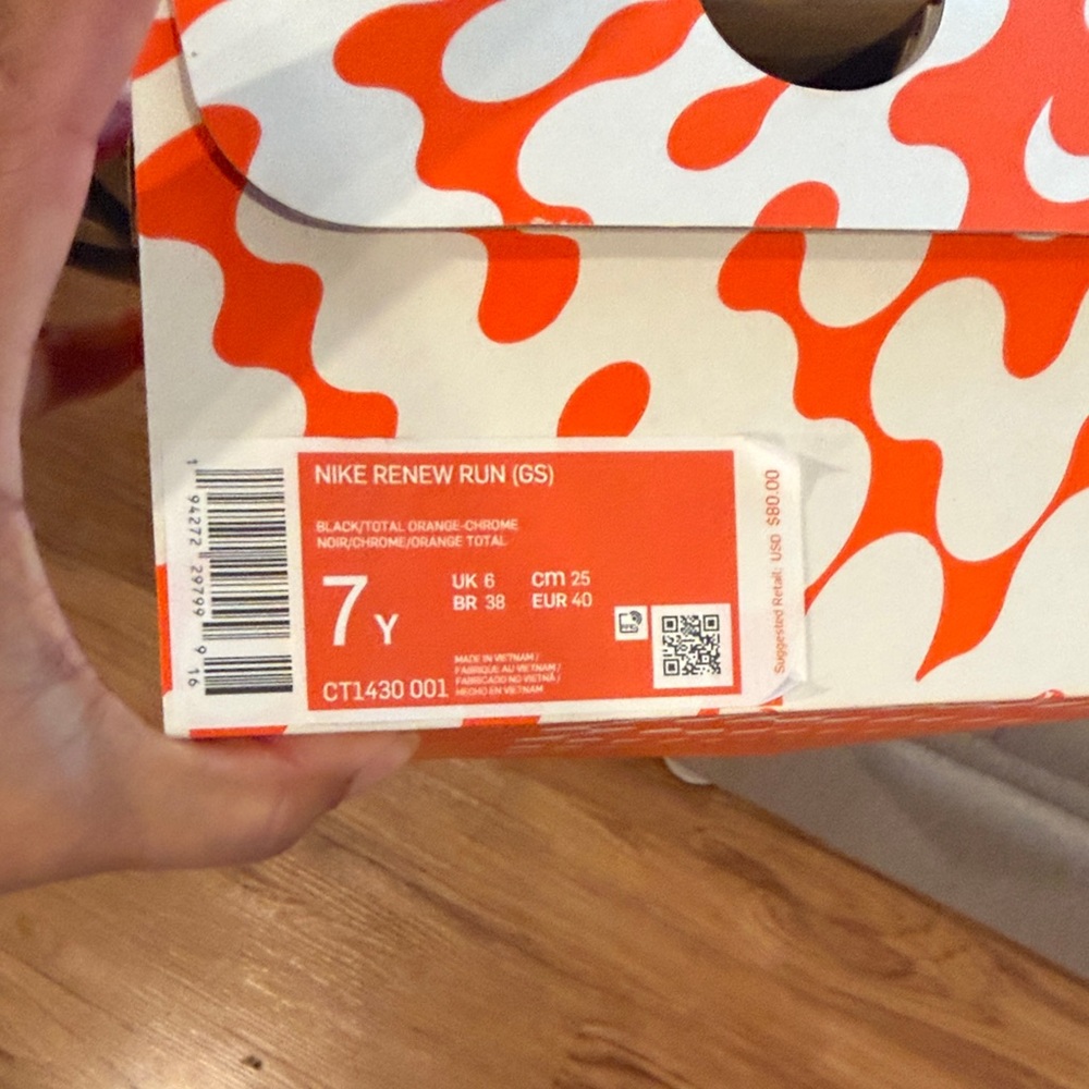 Nike Renew Run GS in Black and Orange